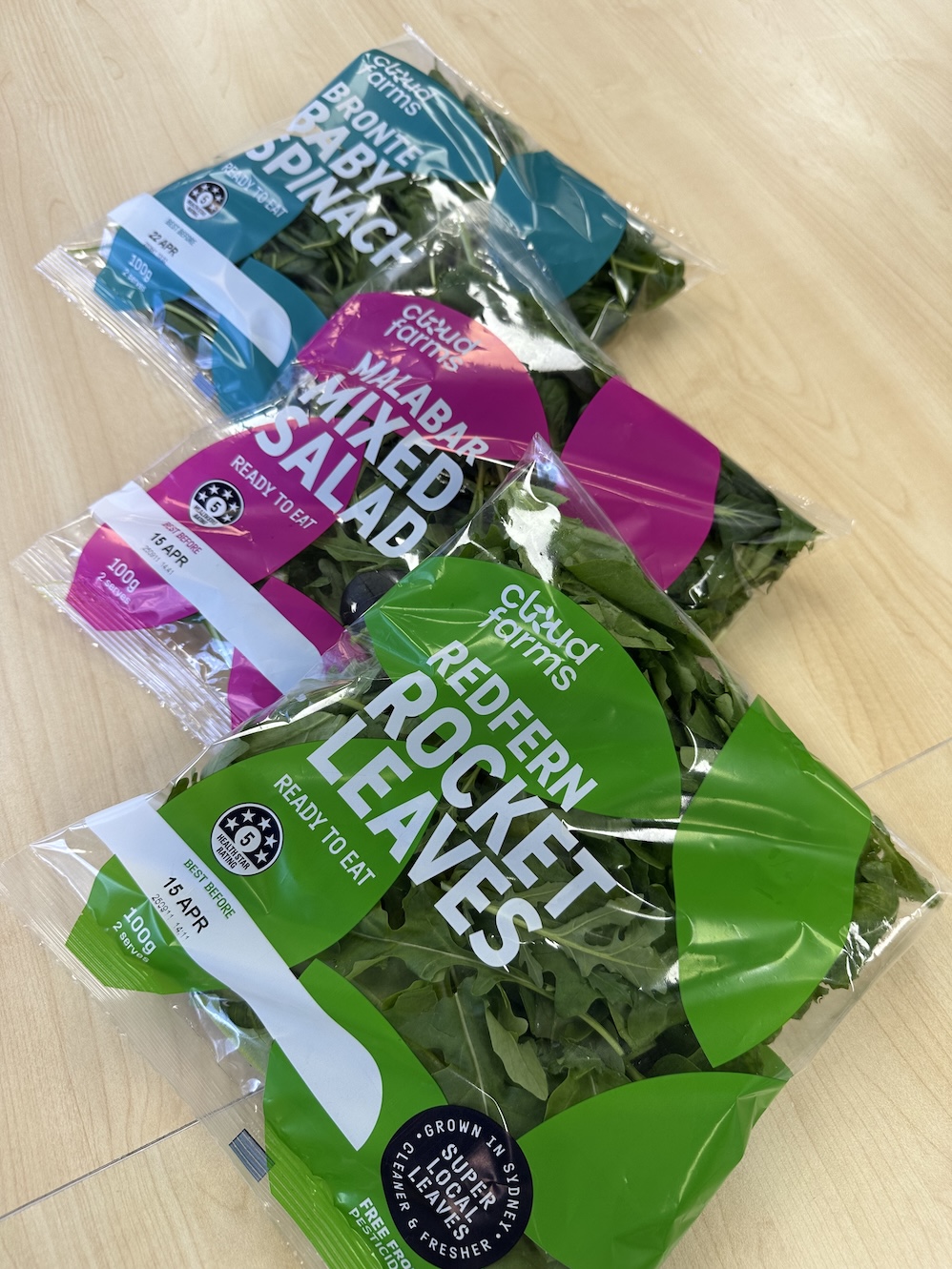 Bowl of fresh Cloudfarms leafy greens — pesticide-free, nutrient-enriched produce with 28-day shelf life